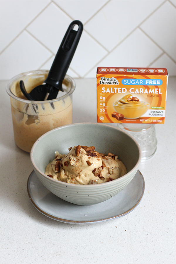 Salted Caramel Apple Pecan Ice Cream preparation Bowl of salted caramel apple pecan ice cream with Ninja Creami pint and Simply Desserts pudding mix